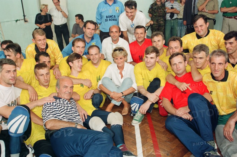 Diana, Princess of Wales makes a three day visit to Bosnia - Herzegovina as part of her campaign to raise awareness about the devastating effects landmines have on peoples lives and to call for a complete ban on the production, sale and use of land mines.
The trip was organised by the American-based Landmine Survivors Network. 
Here she is pictured watching members of a Zenica volleyball team who have suffered injuries from mines during her visit to the city.
9th August 1997.