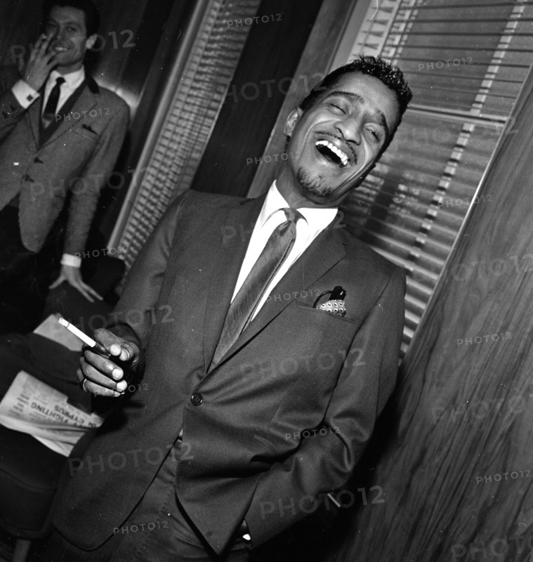 Sammy Davis Jnr at a press reception in Soho cinema showing slips of his new film Robin and his hood men.
10th March 1964.
S2200