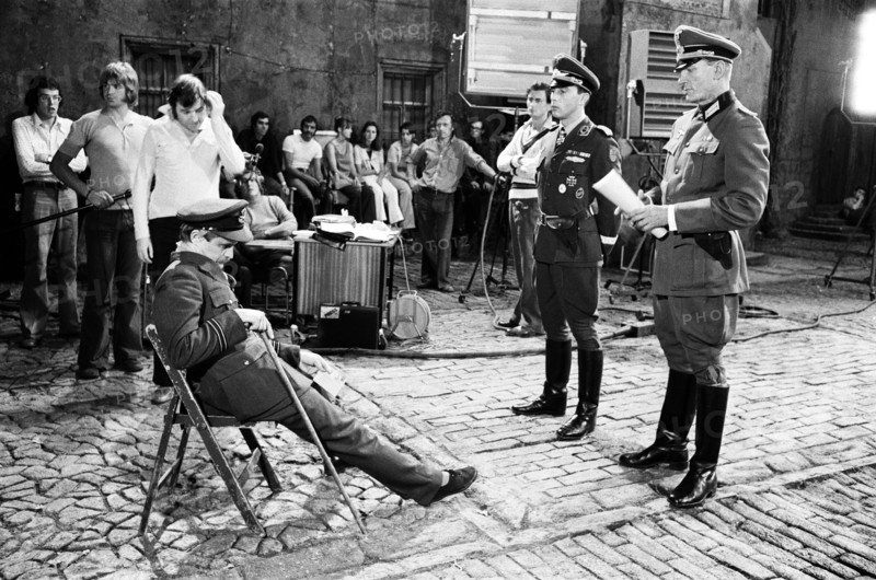 Actor David McCallum (seated) on the film set during filming of 'Colditz', the BBC TV series. He played the part of Flight Lieutenant Simon Carter. Ealing Studios, London, 7th September 1973.