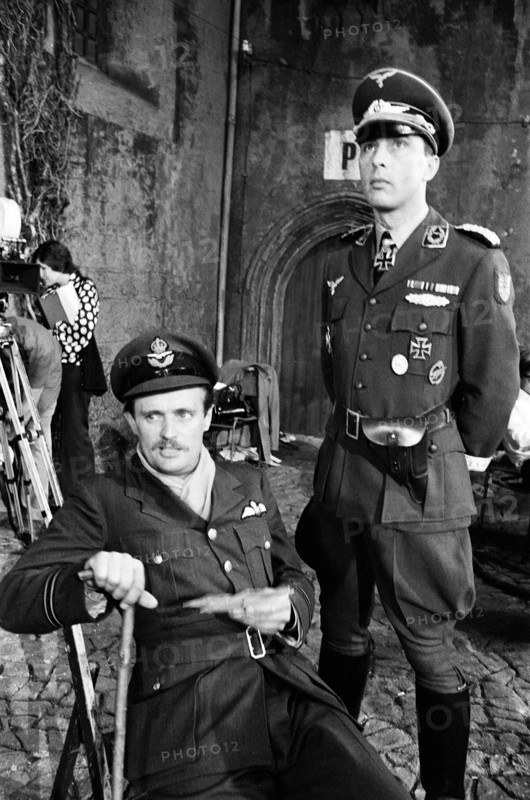 Actors David McCallum (left) and Anthony Valentine on the film set during filming of 'Colditz', the BBC TV series. David McCallum played the part of Flight Lieutenant Simon Carter and Anthony Valentine played Major Horst Mohn, 2nd in command. Ealing Studios, London, 7th September 1973.