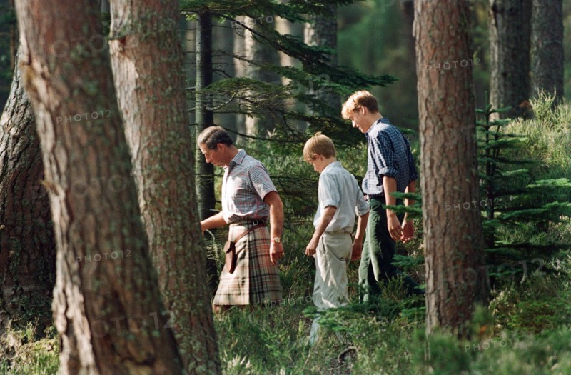 Prince Charles with sons Prince William and Prince Harry. Pictured on the banks of the River Dee at an official photocall at Balmoral, Scotland. 12th August 1997.