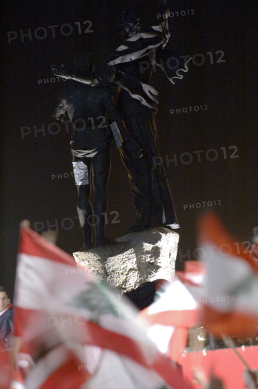 Lebanese protestors celebrate victory at Martyr's Square in Beirut