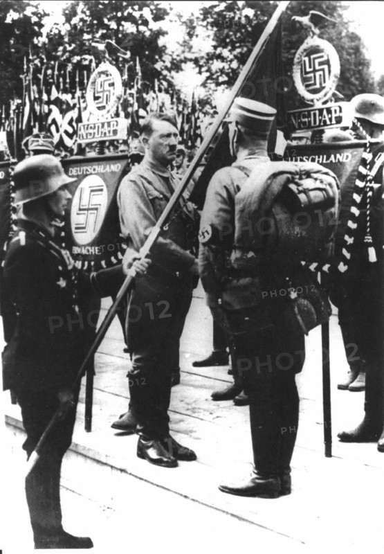 Hitler consecrating the new flags of the Reich
