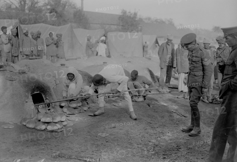 Orleans, camp of Indians.  Putting bread in the oven.