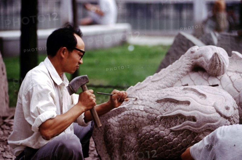 A man carving stone