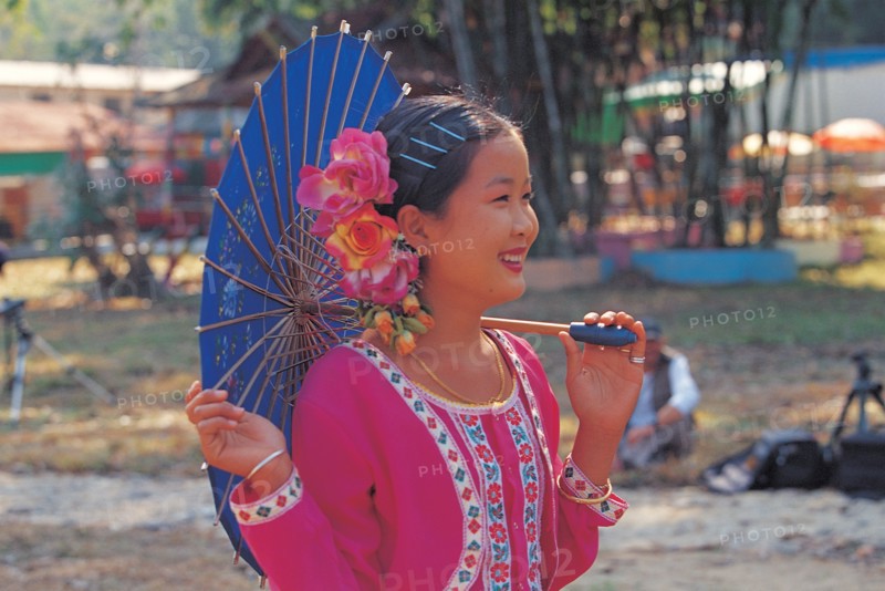 Chinese woman wearing the traditional costume, China