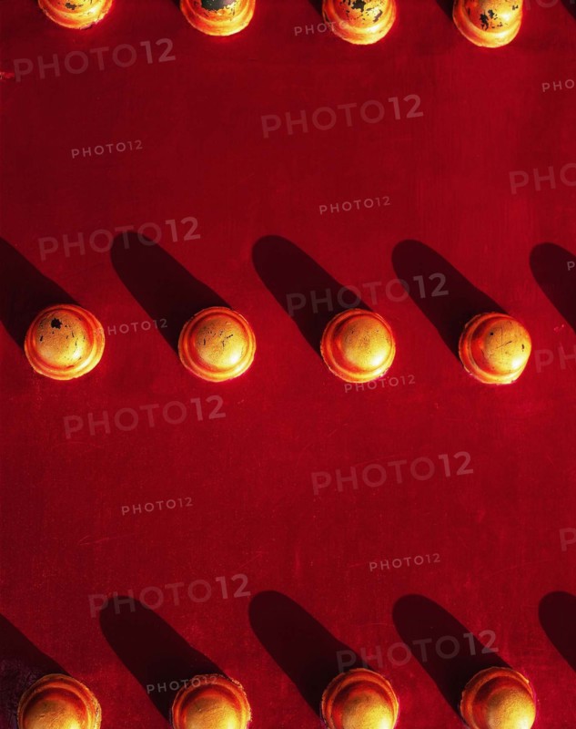 The knob on the red painted gate of the Forbidden City,Beijing,China