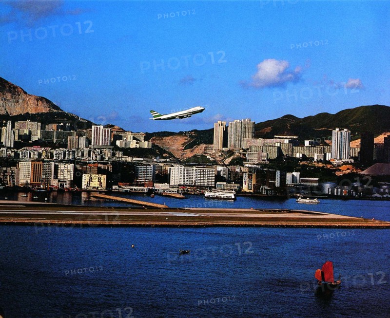 A plane takes off from the Kai Tak International Airport,Hong Kong,China