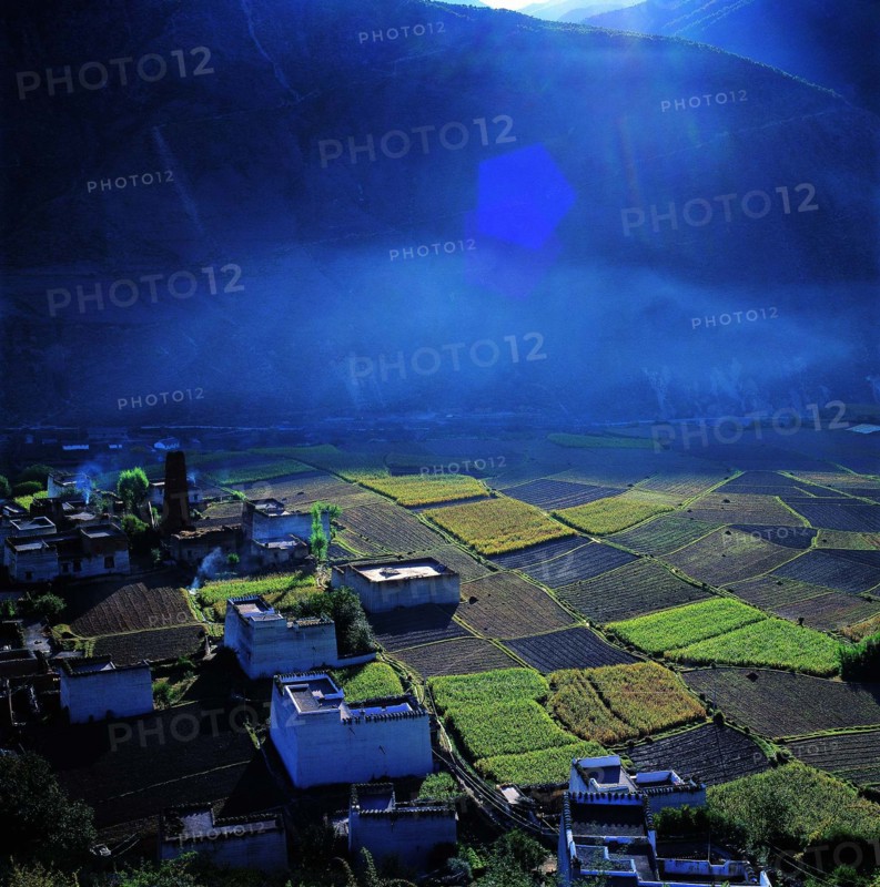 the field and cottages in Derong County,Sichuan Province,China