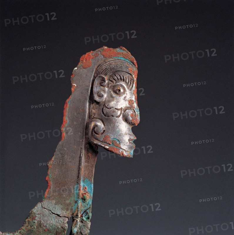 face-shaped ornament from West Zhou Dynasty of ancient Chinaon bronze halberd