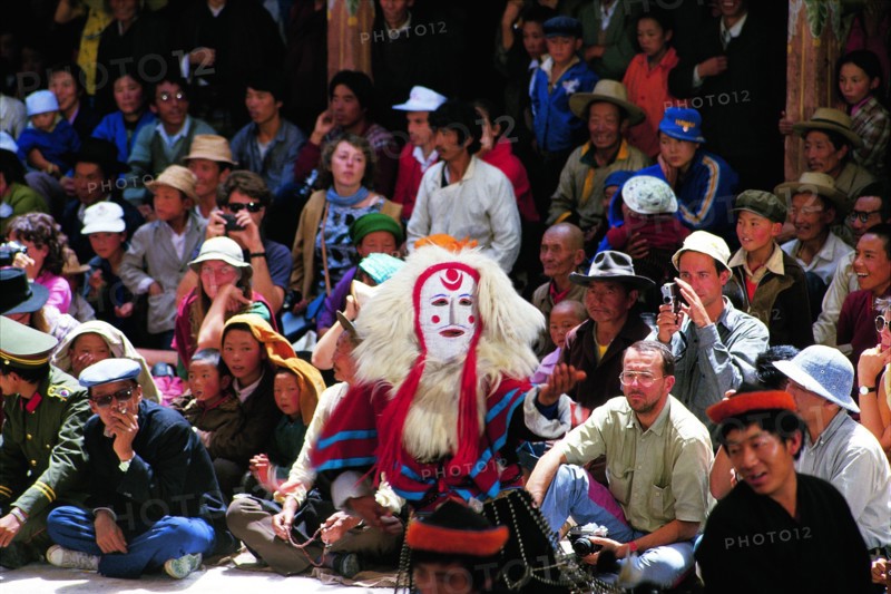Visiters watch Tibetan Opera in Drepung Monastery, Tibet,China