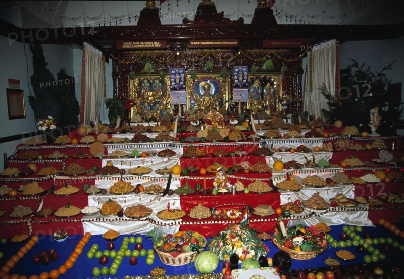 A temple altar covered with offerings at the Diwali festival