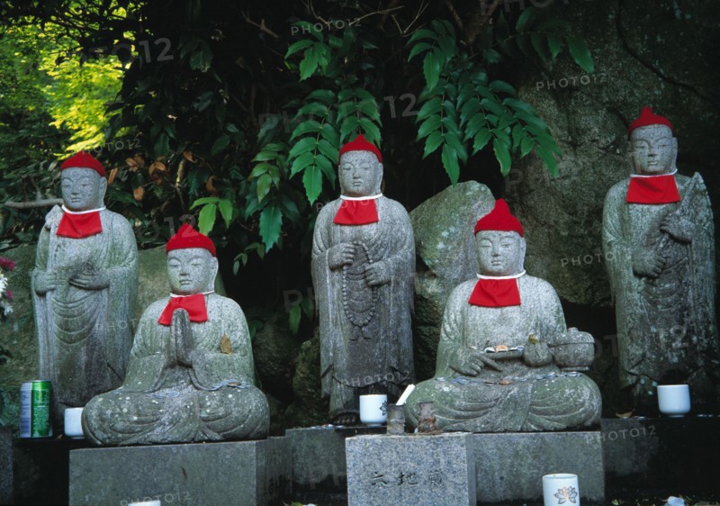 Jizou spirit guardians in a temple garden in Japan