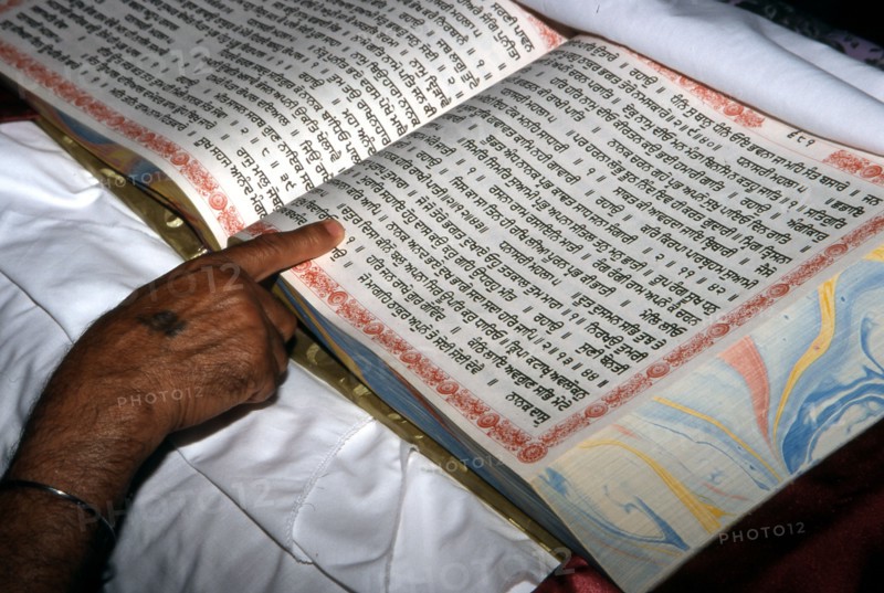 The Granthi choosing name for a new-born baby