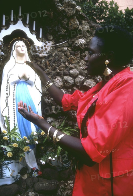 Woman outside St. Joseph's Cathedral, Gambia
