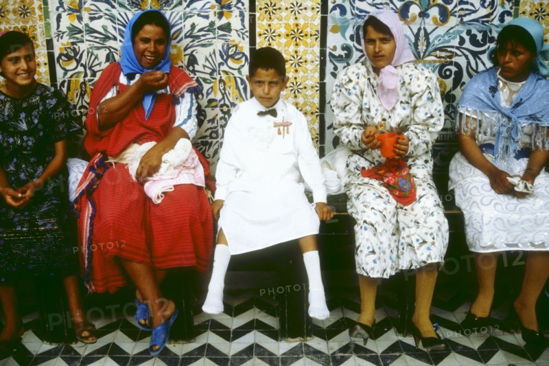 Newly circumcised boy with his family