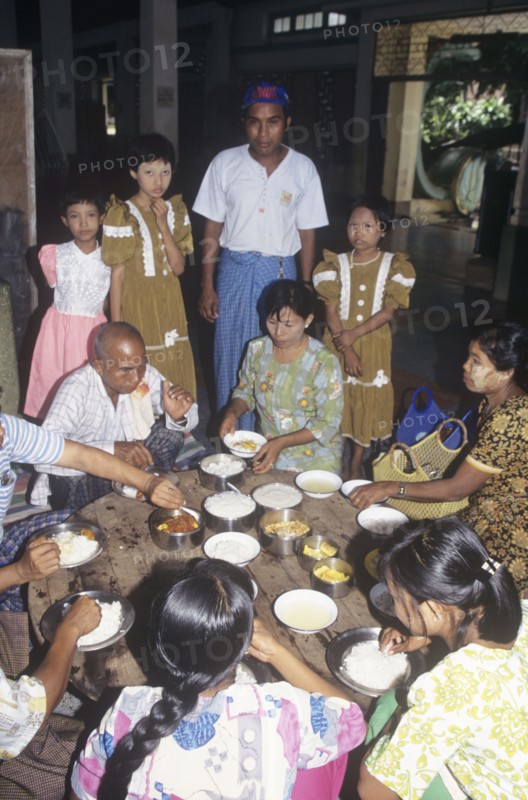 Buddhist family lunch in a temple in Myanmar
