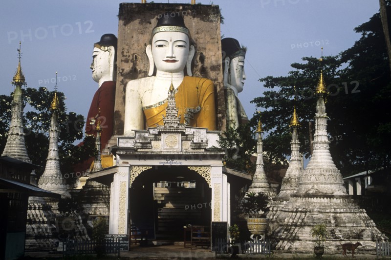 Four giant seated Buddhas in the town of Pegu Myanmar