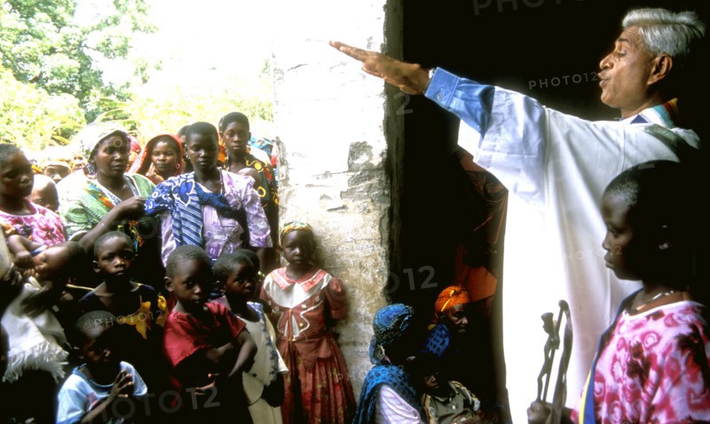 Catholic priest from Indian welcomes people into his small rural church Tanzania