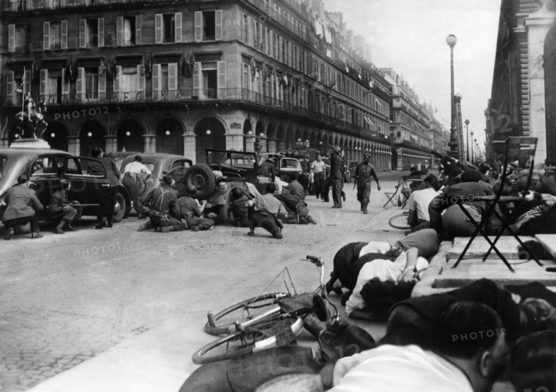Rue de Rivoli, Paris, the crowd trying to hide from the snipers