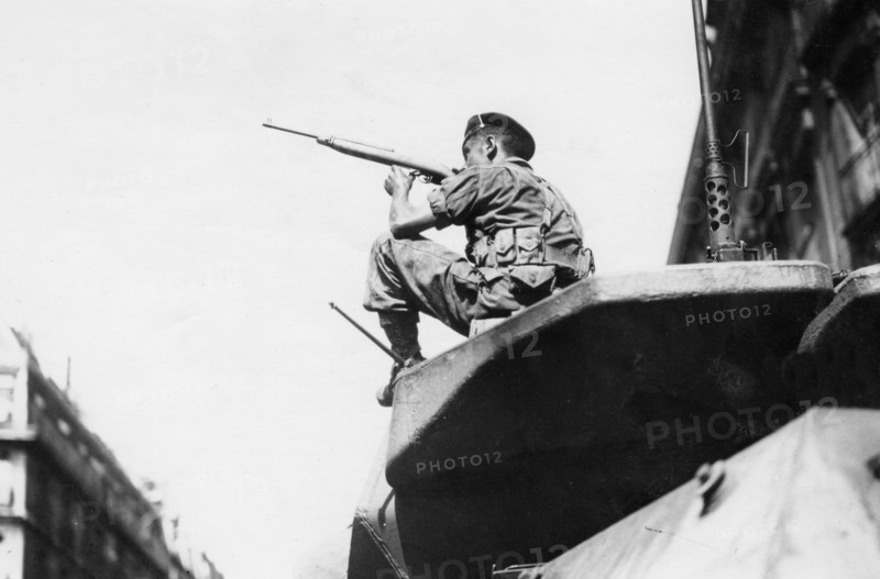 A French soldier in fighting position in a street of Paris, during the Liberation (August 1944)
