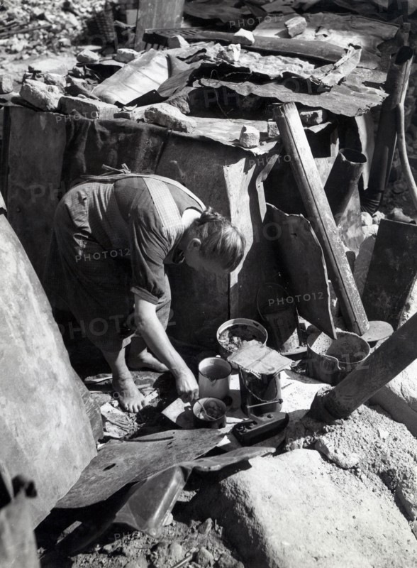 Old woman from Nuremberg coocking a poor meal