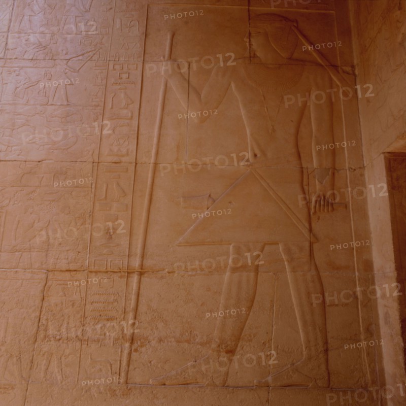 Sakkara, Mastaba of Kagemni, the master of the tomb, equipped with the rod and scepter for the consecration of offerings, receiving offerings