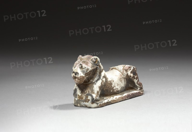 Figurine représentant un lion couché