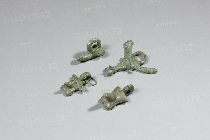 Four phallic amulets