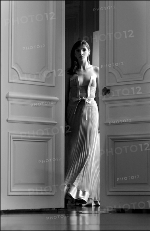 05/00/2003. EXCLUSIVE Clotilde Courau tries gowns on at Valentino's before the 56th Cannes Film