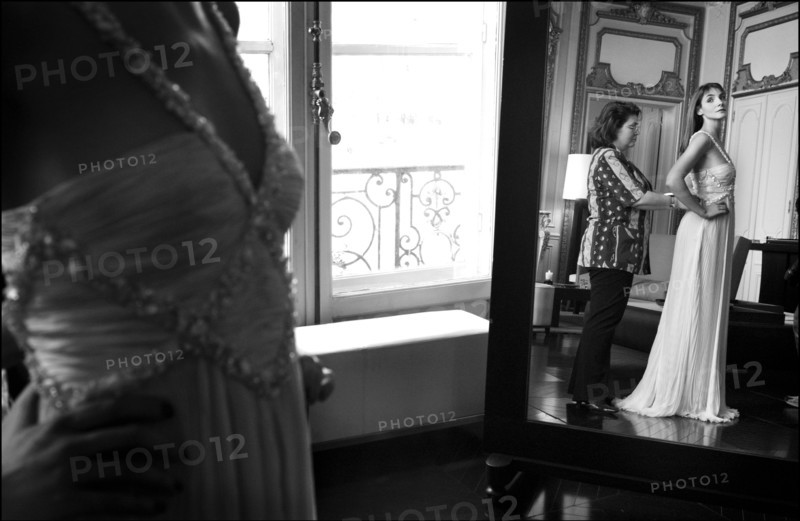 05/00/2003. EXCLUSIVE Clotilde Courau tries gowns on at Valentino's before the 56th Cannes Film