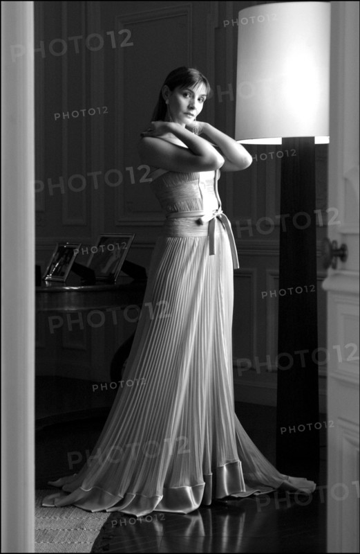 05/00/2003. Clotilde Courau tries gowns on at Valentino's before the 56th Cannes Film
