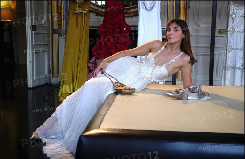 05/00/2003. EXCLUSIVE Clotilde Courau tries gowns on at Valentino's before the 56th Cannes Film