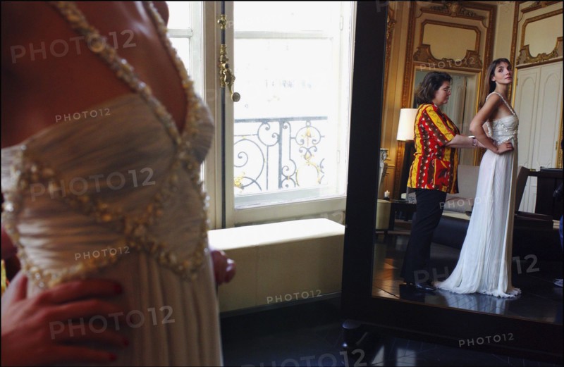 05/00/2003. EXCLUSIVE Clotilde Courau tries gowns on at Valentino's before the 56th Cannes Film