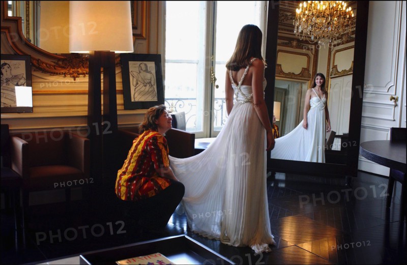 05/00/2003. Clotilde Courau tries gowns on at Valentino's before the 56th Cannes Film