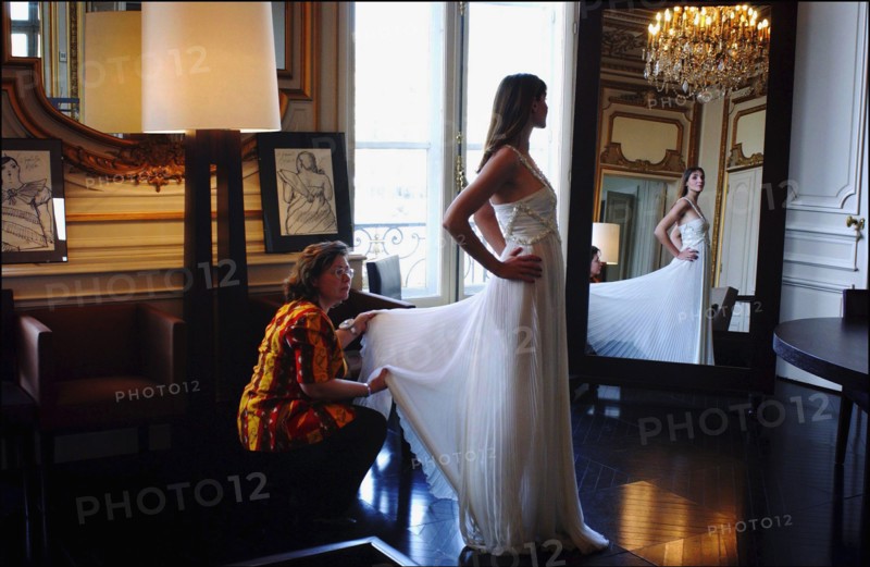 05/00/2003. EXCLUSIVE Clotilde Courau tries gowns on at Valentino's before the 56th Cannes Film