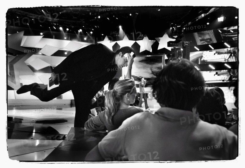 12/00/2003. Nikos Aliagas, host of the Star Academy shows backstage and on stage.