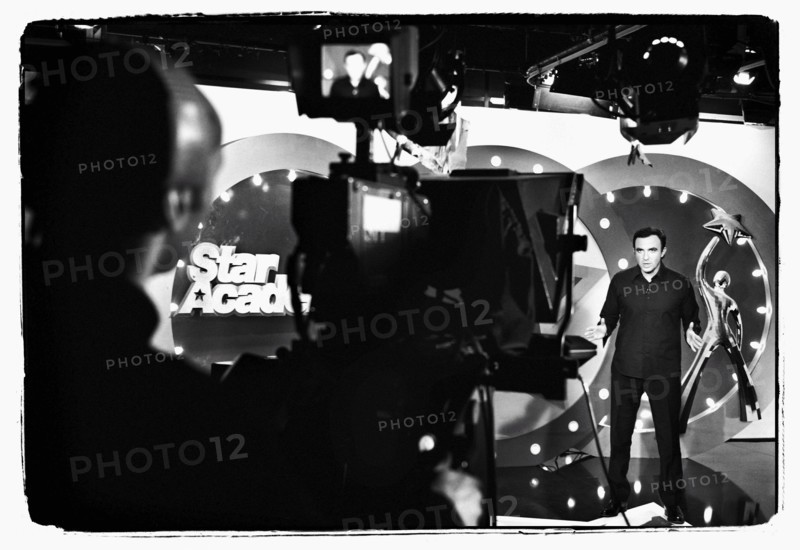 12/00/2003. Nikos Aliagas, host of the Star Academy shows backstage and on stage.