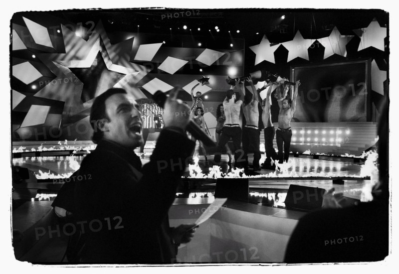 12/00/2003. Nikos Aliagas, host of the Star Academy shows backstage and on stage.