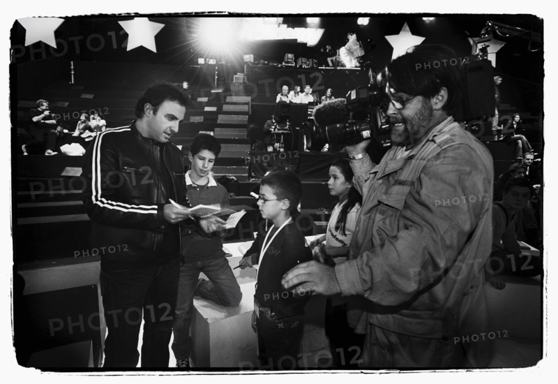 12/00/2003. Nikos Aliagas, host of the Star Academy shows backstage and on stage.