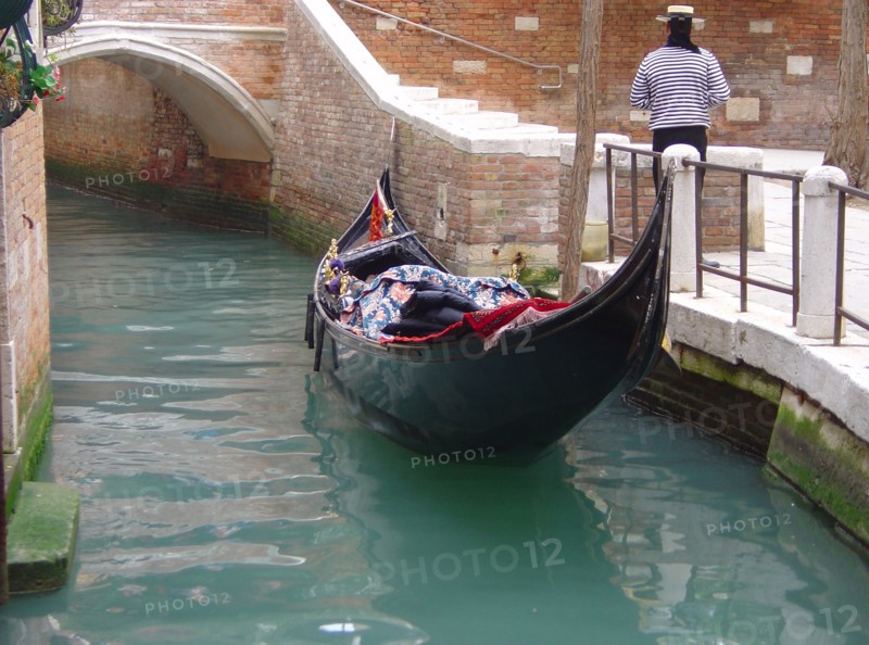 Venice. Gondola alongside the quay