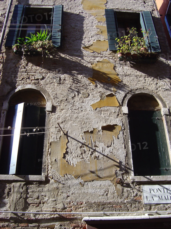 Rendered facade in a Venitian alley
