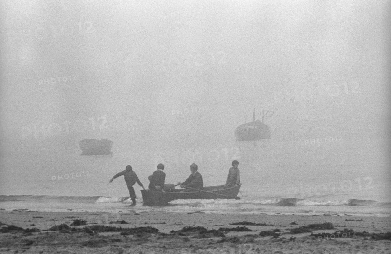 Boat landing in mist, Saltee Islands