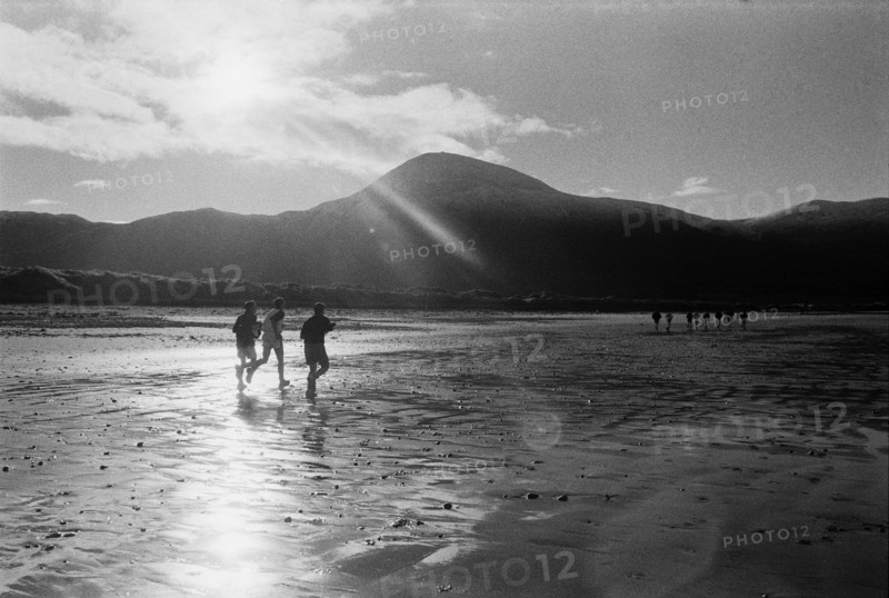 Runners on a beach against the light, with Croagh Patrick mountain in the background. County Mayo, Ireland.
2001