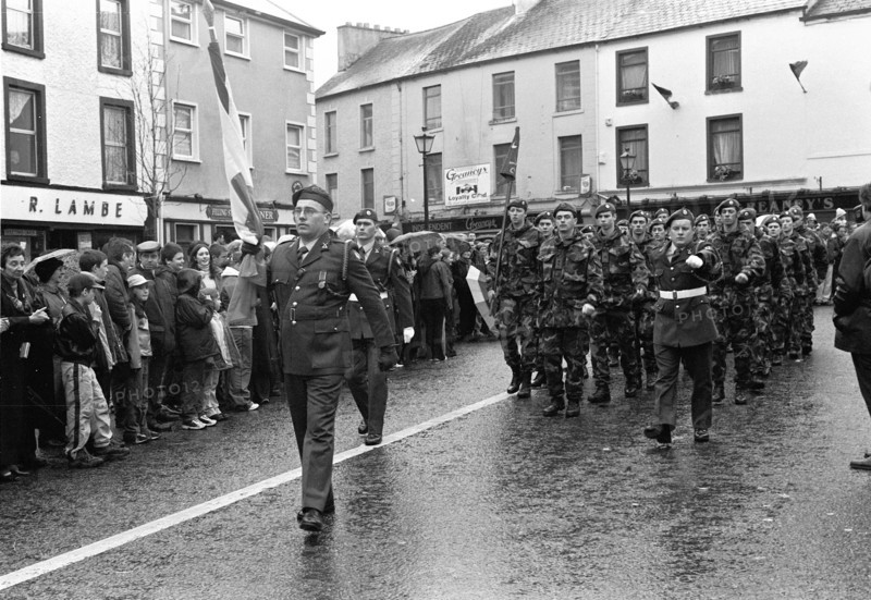 St Patrick's Day parade: participants in uniform marching down the street in front of spectators. Swinford, County Mayo, Ireland.
2001
