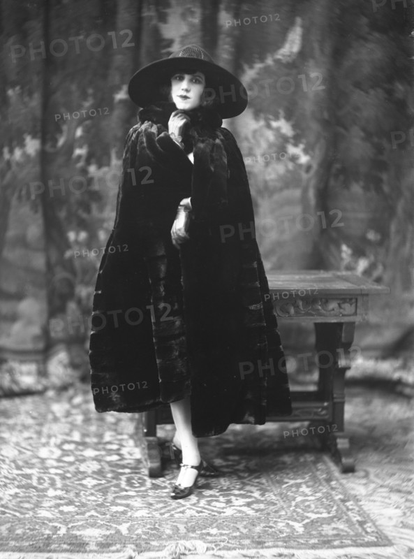 Female model wearing a fur coat designed by Max Leroy