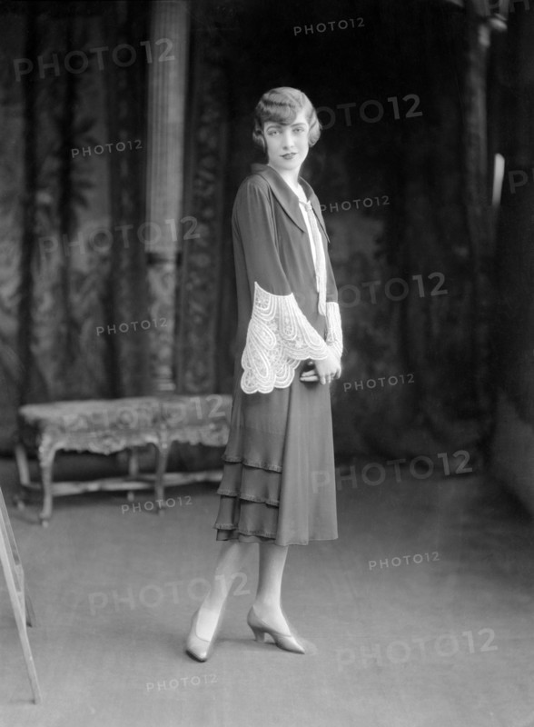 Female model wearing a dress designed by Worth