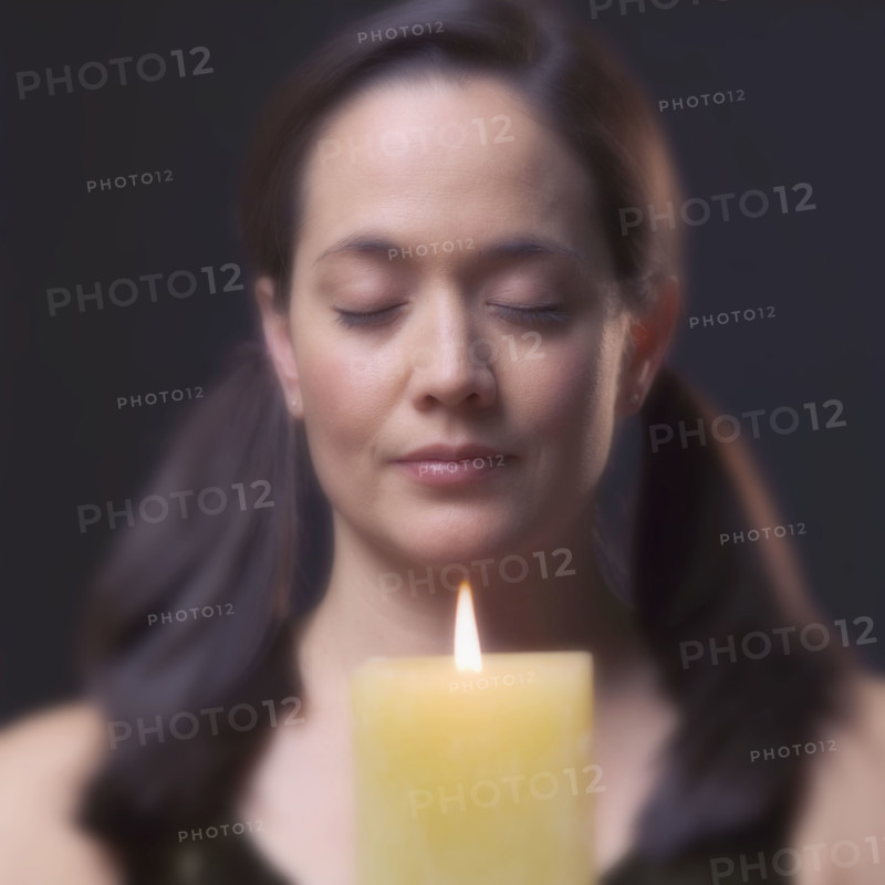 Woman with candle.