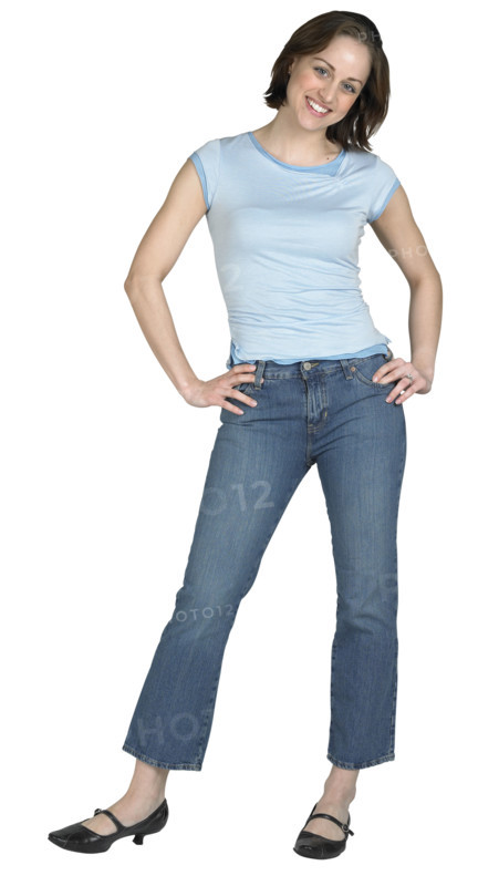 A woman standing with her hands on her hips.