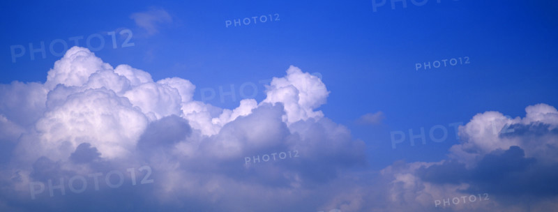 Puffy clouds and blue sky.